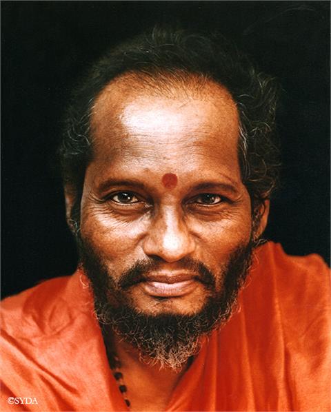 Close up portrait of Baba against a dark background