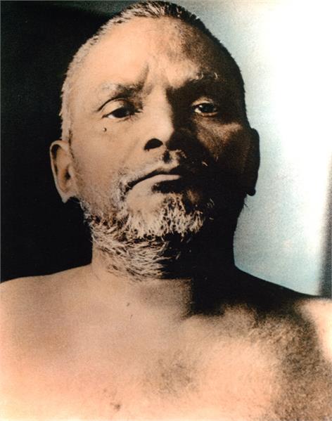 Close up photo of Nityananda against black and white background